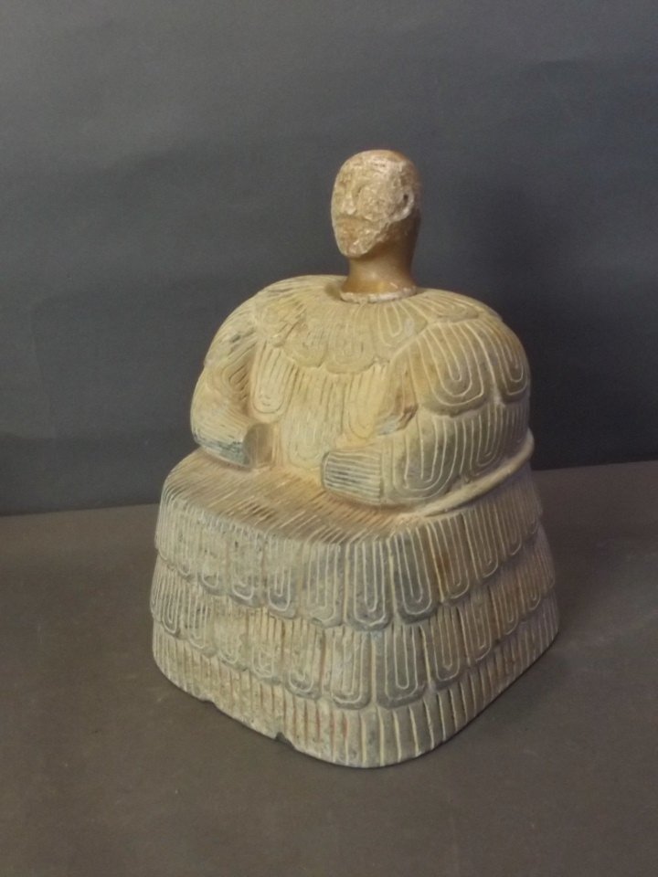 An Indo-Persian carved hardstone votive figure with: An Indo-Persian carved hardstone votive figure with weathered marble head, 8'' high