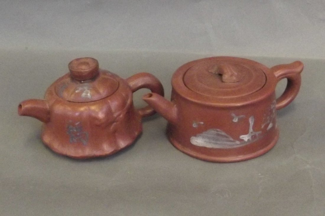 Two Yixing miniature teapots decorated with calligraphy: Two Yixing miniature teapots decorated with calligraphy and landscapes, 1¾'' high