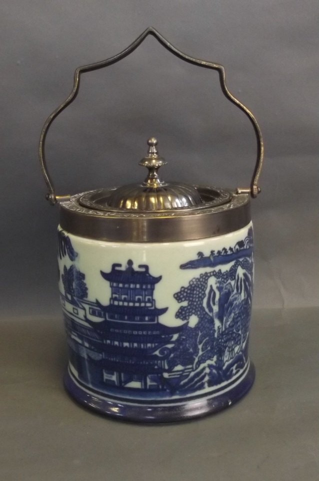 A blue and white biscuit barrel with metal handle and: A blue and white biscuit barrel with metal handle and lid, 7'' high