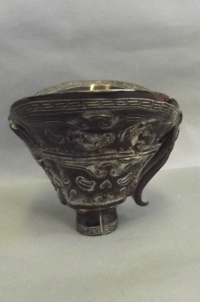 A Chinese horn libation cup carved with bats, 5½'' high: A Chinese horn libation cup carved with bats, 5½'' high