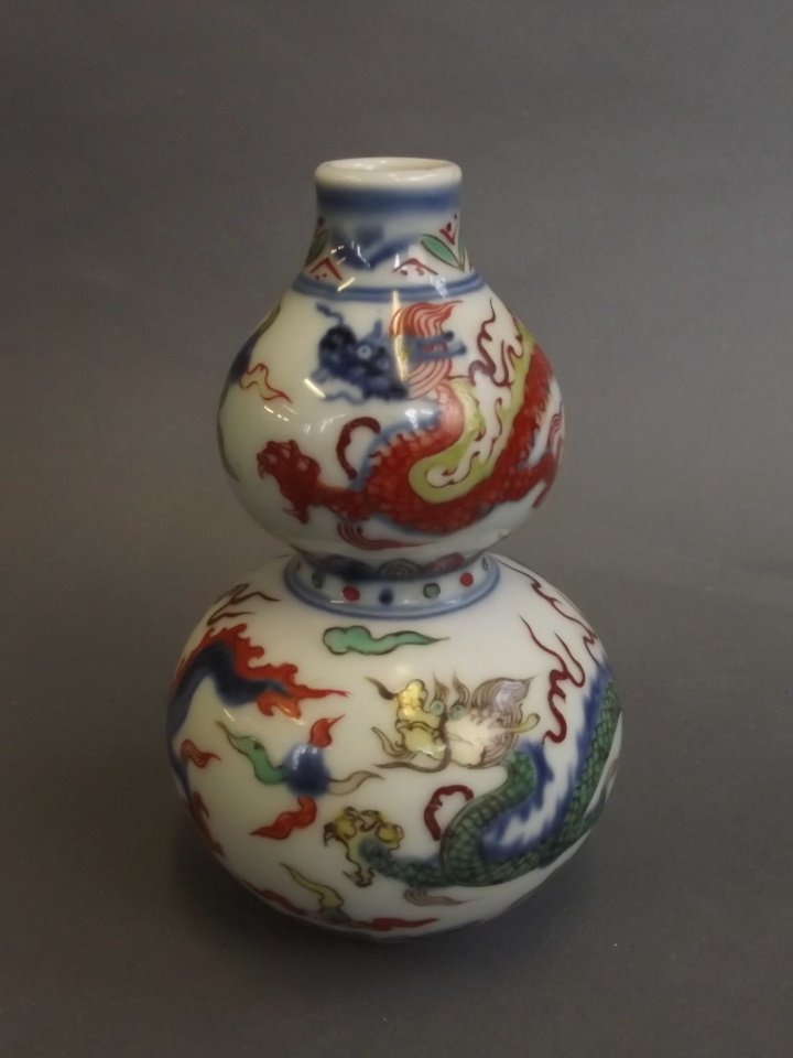 A small Chinese Doucai enamel double gourd porcelain: A small Chinese Doucai enamel double gourd porcelain vase with painted dragon decoration, 6 character mark, 4½'' high