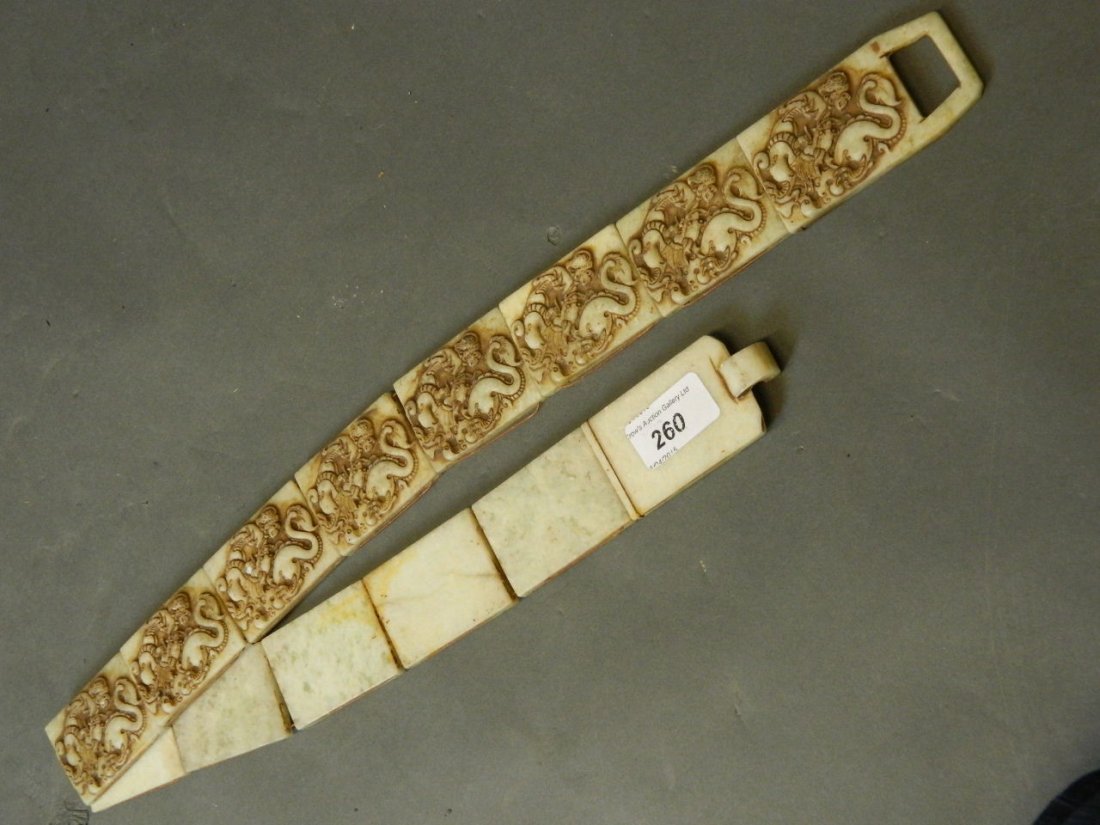 A Chinese sectional soapstone belt with carved dragon: A Chinese sectional soapstone belt with carved dragon decoration, 37'' long