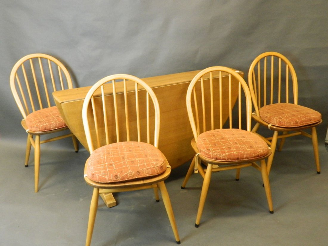An Ercol drop leaf dining table and four chairs, c1960,: An Ercol drop leaf dining table and four chairs, c1960, table 51'' long