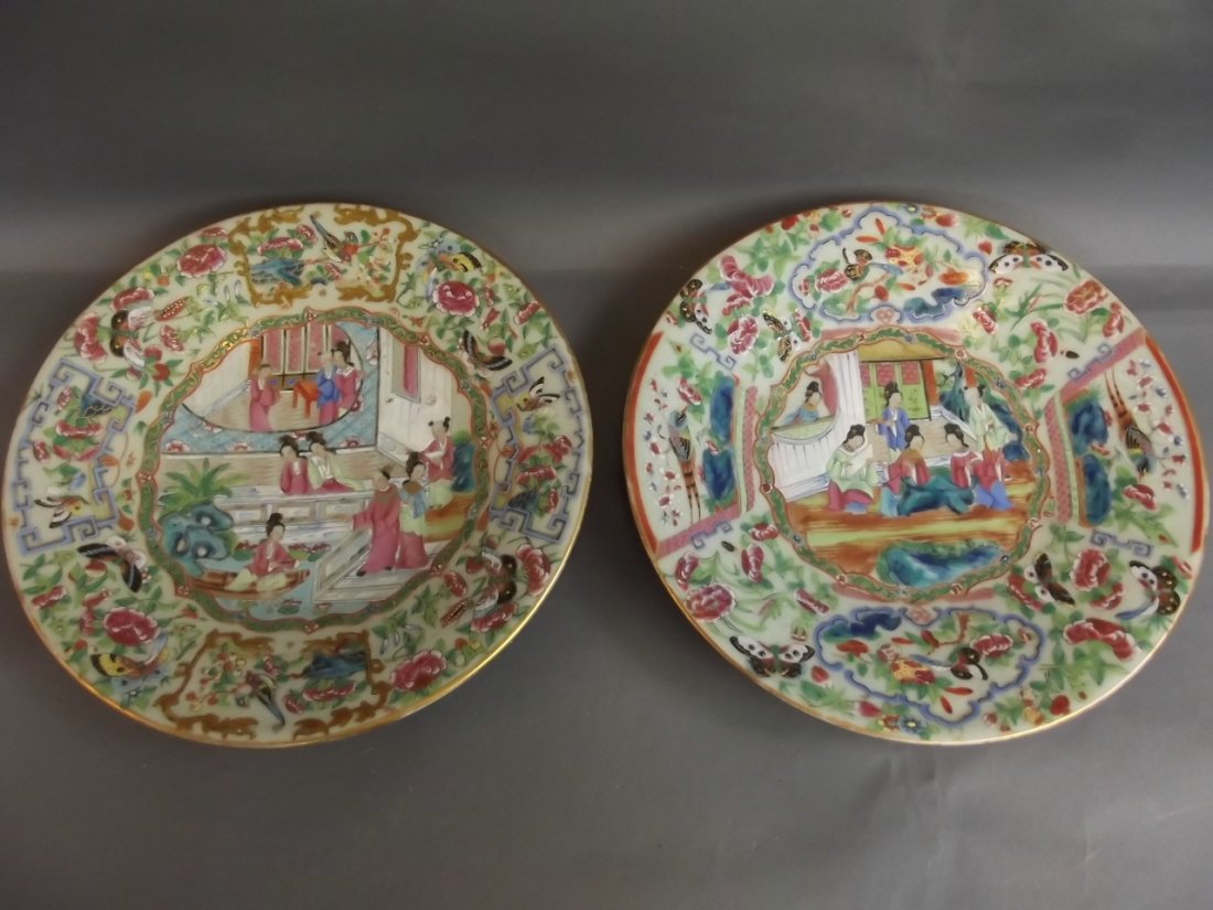 A pair of C19th Cantonese plates painted with figures: A pair of C19th Cantonese plates painted with figures and butterflies, with flowers to rims, 10'' diameter