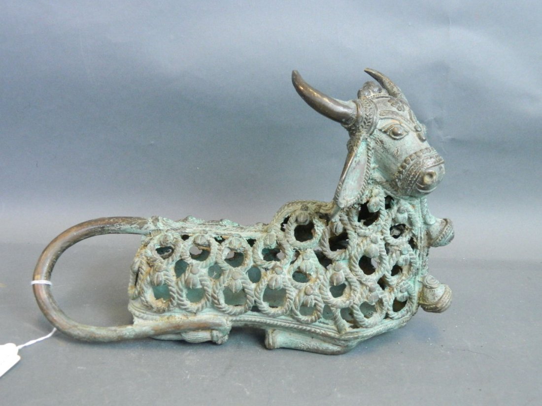 An Indo-Persian pierced brass censer in the form of a: An Indo-Persian pierced brass censer in the form of a bird, 11'' long