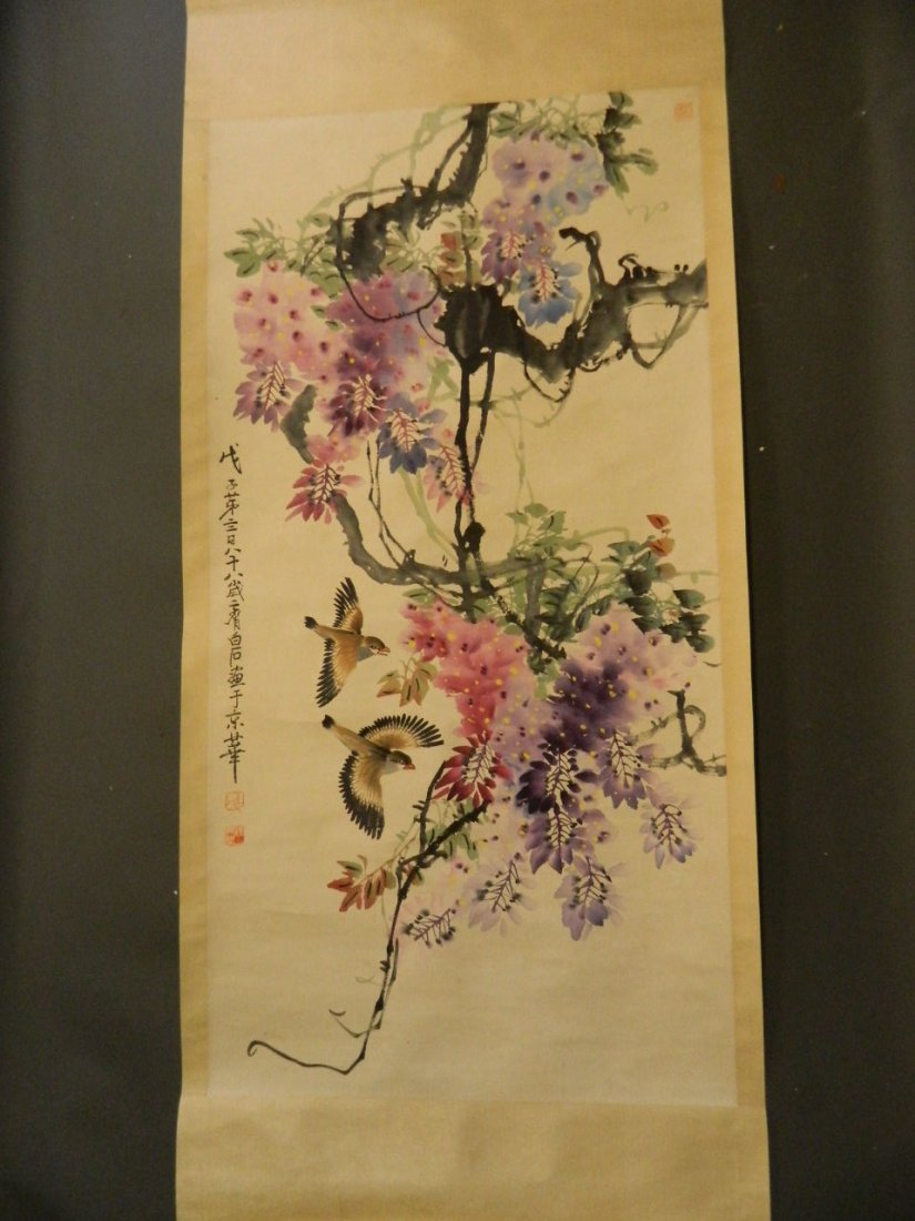 A Chinese watercolour scroll depicting two love birds: A Chinese watercolour scroll depicting two love birds in flight amongst flowers, 25½'' x 50¼''