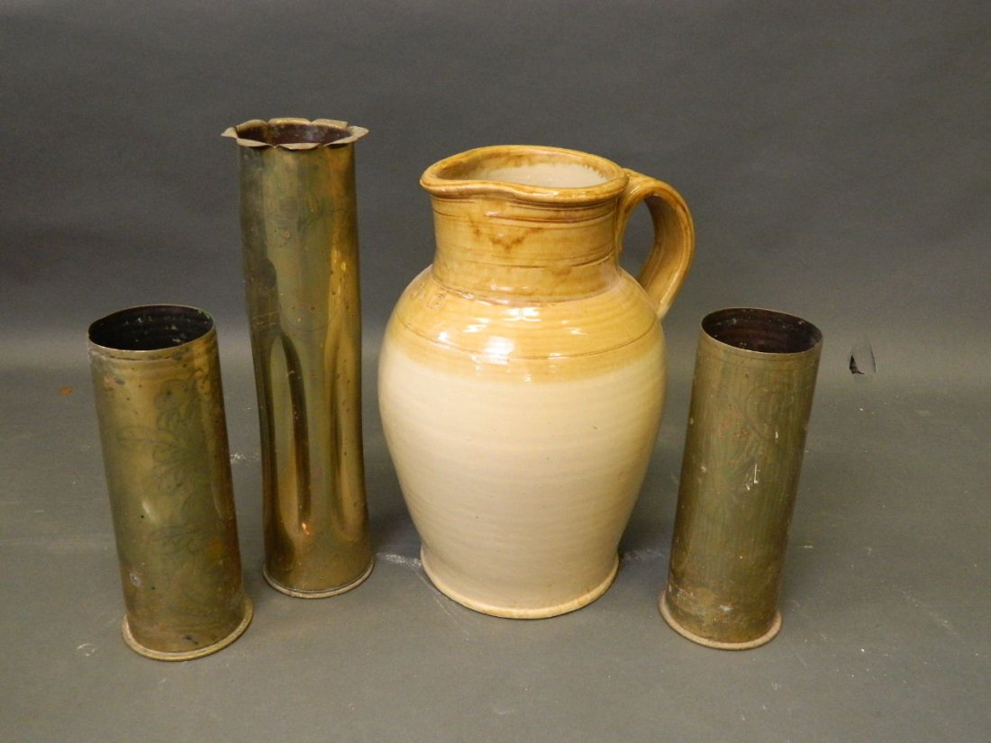 A large 1 gallon stoneware jug, and three engraved: A large 1 gallon stoneware jug, and three engraved brass trench Art Deco shell cases, jug 12½'' high