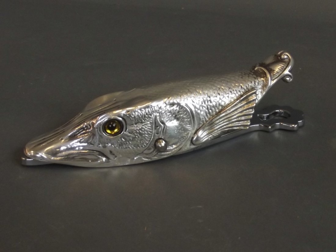 A large silver plated paper clip in the form of a: A large silver plated paper clip in the form of a fish's head, 6'' long