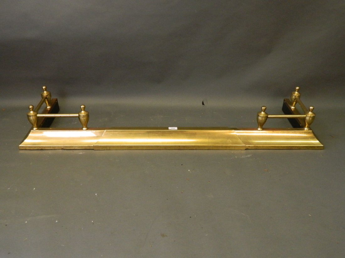 An extending brass fender, extending from 52'' to 71'': An extending brass fender, extending from 52'' to 71''