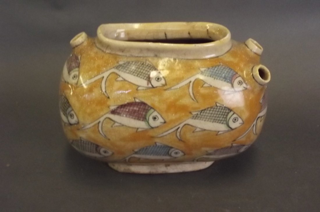 A Persian glazed terracotta squat vase with painted (1 of 2)