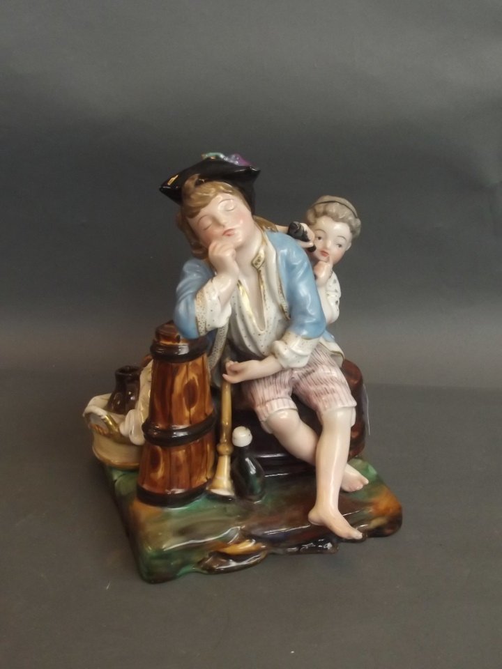 A C19th Continental porcelain figure group depicting a (1 of 2)
