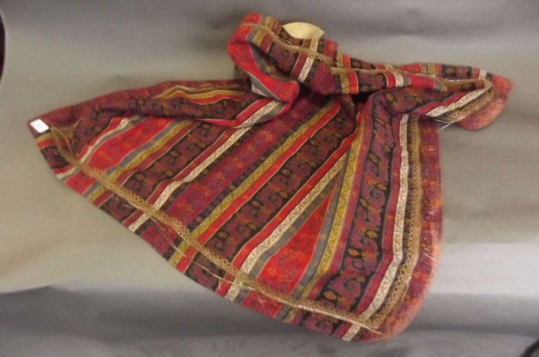 A Middle Eastern hand woven cover embroidered with a (1 of 4)