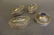 Four Middle Eastern white metal trinket boxes inset