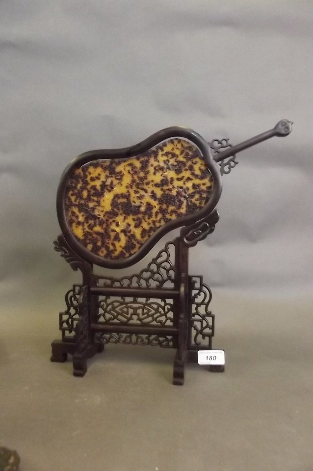 A Chinese faux tortoiseshell fan mounted in a carved (1 of 1)