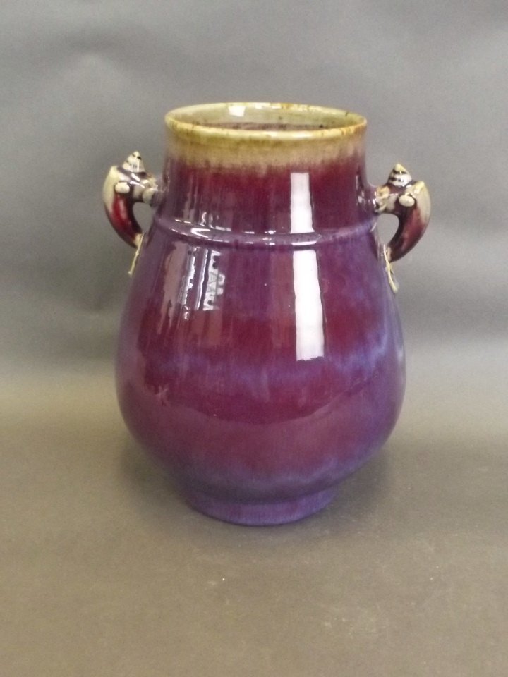 A Chinese twin handled flambé glazed vase, 11'' high: A Chinese twin handled flambé glazed vase, 11'' high