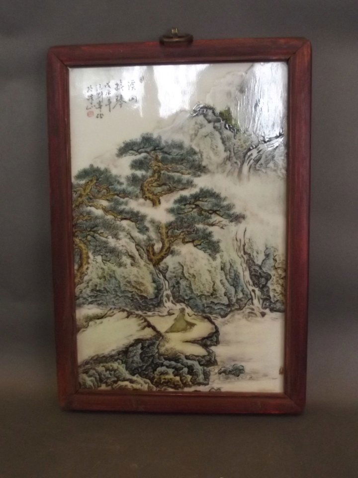 A small Chinese ceramic panel decorated with a seated (1 of 1)