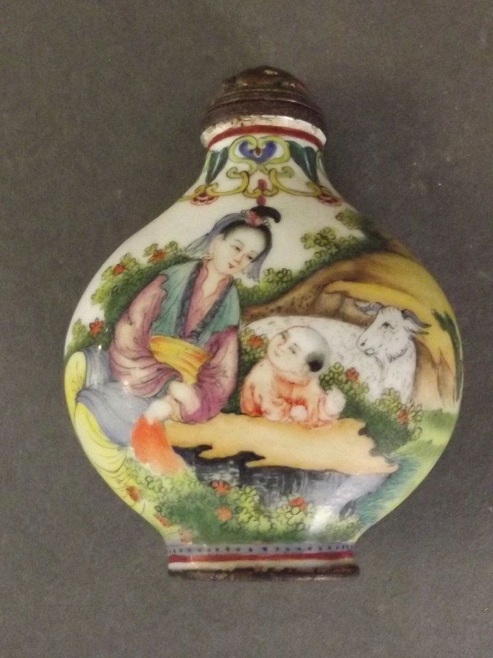 A Cantonese enamel snuff bottle depicting a mother and (1 of 2)