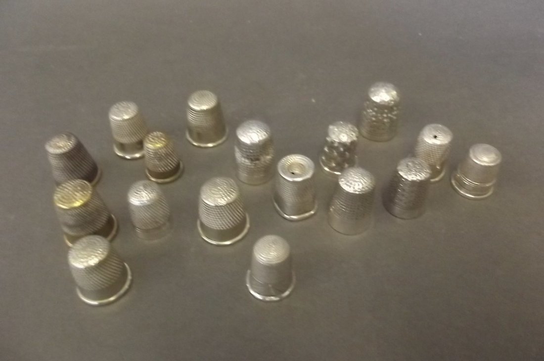A collection of seventeen thimbles, some Hallmarked: A collection of seventeen thimbles, some Hallmarked silver to include Dorcas and Horner