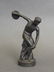 A C19th bronze figure in the form of a discus thrower,
