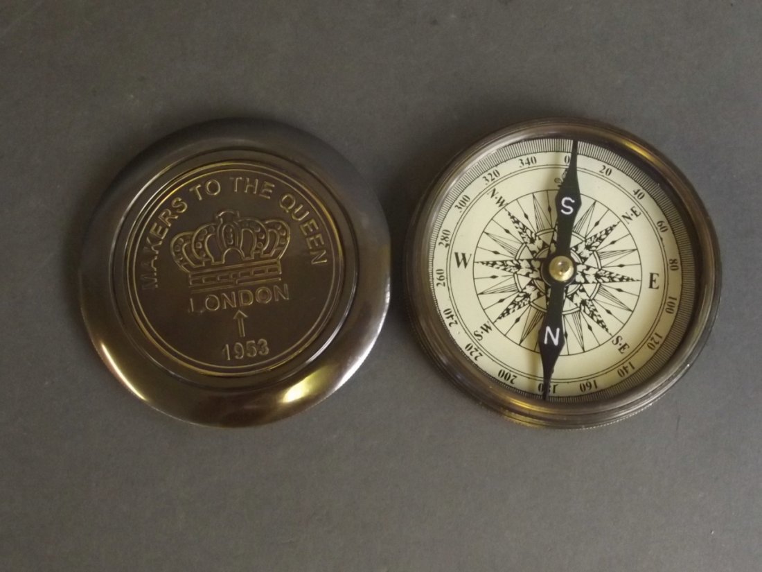 A brass cased hand-held pocket compass with a Robert (1 of 2)
