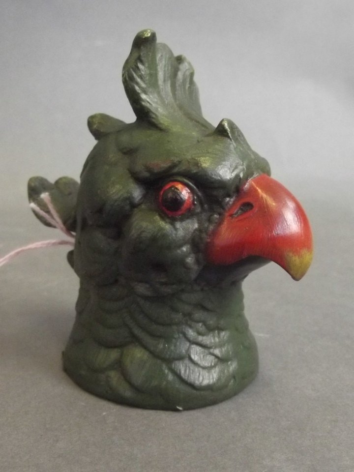 A cold painted bronze inkwell in the form of a parrot's (1 of 2)