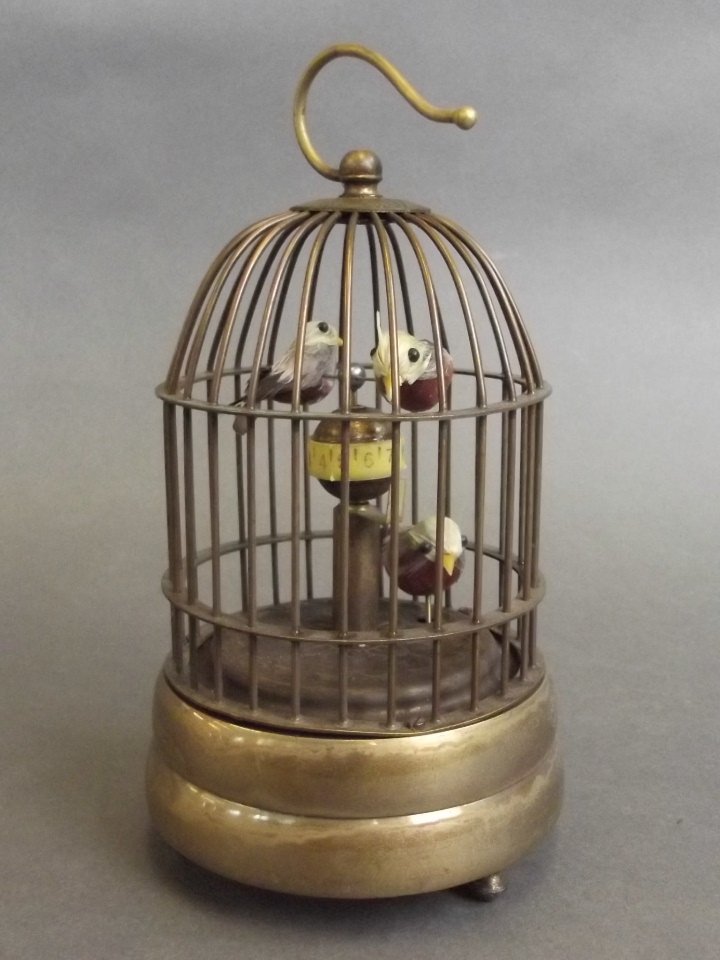 A cased brass automaton birdcage clock, 6½'' high (1 of 2)