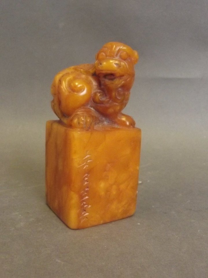 A Chinese soapstone seal with carved kylin knop and (1 of 2)