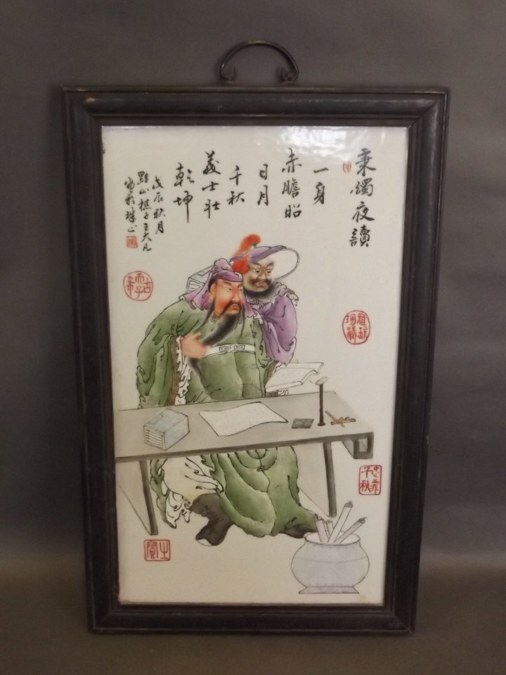 A Chinese porcelain plaque with painted enamel: A Chinese porcelain plaque with painted enamel decoration of a scribe with apprentice, mounted in a hardwood frame, 15½'' x 24½''