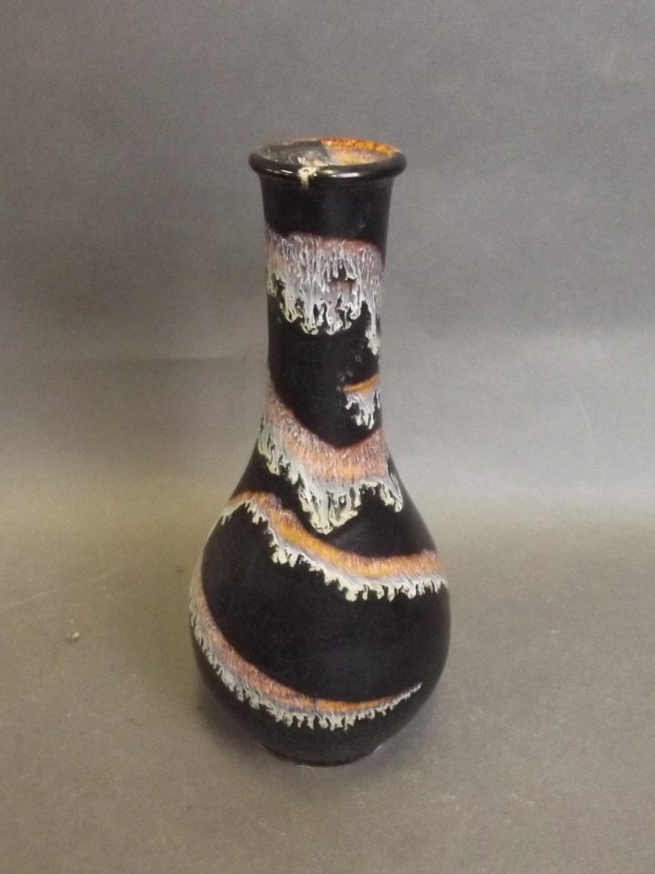 A Chinese Cizhou Kiln black ground pattern spill vase: A Chinese Cizhou Kiln black ground pattern spill vase with drip glaze decoration, 7½'' high