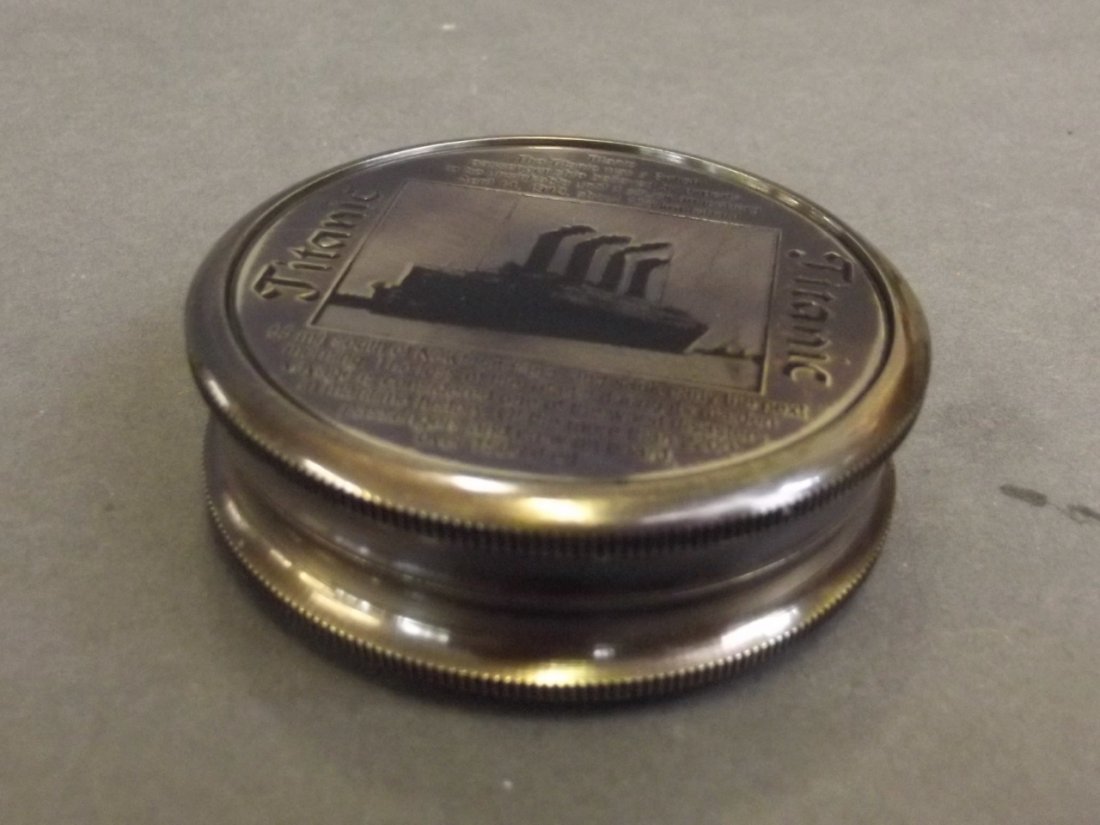 A circular brass compass with engraved decoration of (1 of 3)