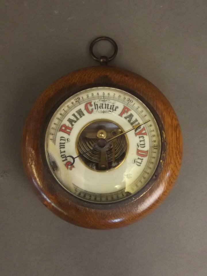 An oak cased Victorian brass barometer with enamelled (1 of 2)
