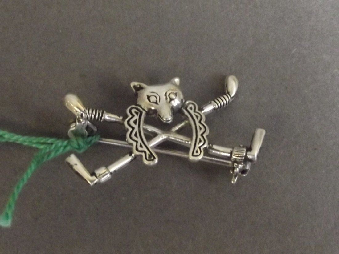 A Sterling silver brooch in the form of a fox, 1¼'': A Sterling silver brooch in the form of a fox, 1¼'' wide