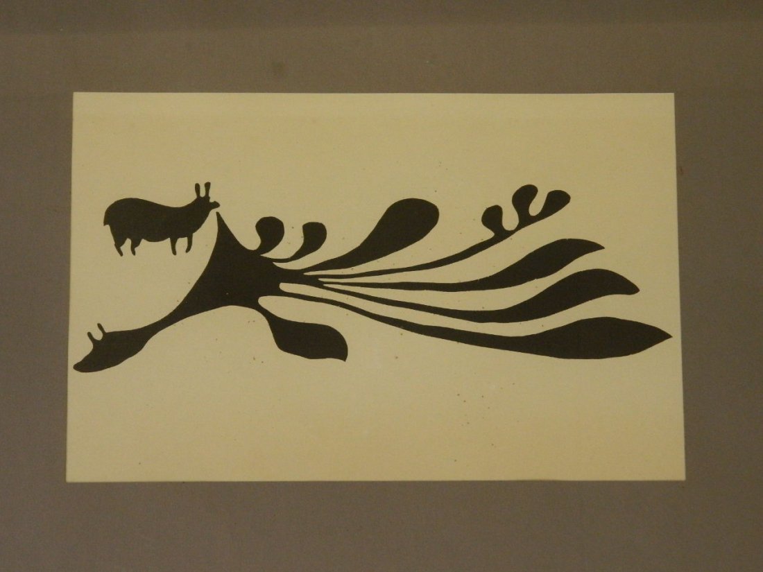A framed print inscribed 'Rabbit Eating Seaweed,