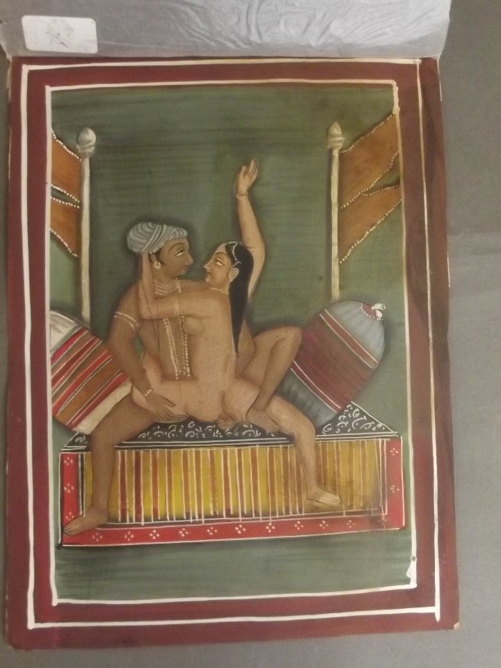 An early C20th Indian erotic miniature painting, man: An early C20th Indian erotic miniature painting, man and woman on a bed, 9½'' x 12''