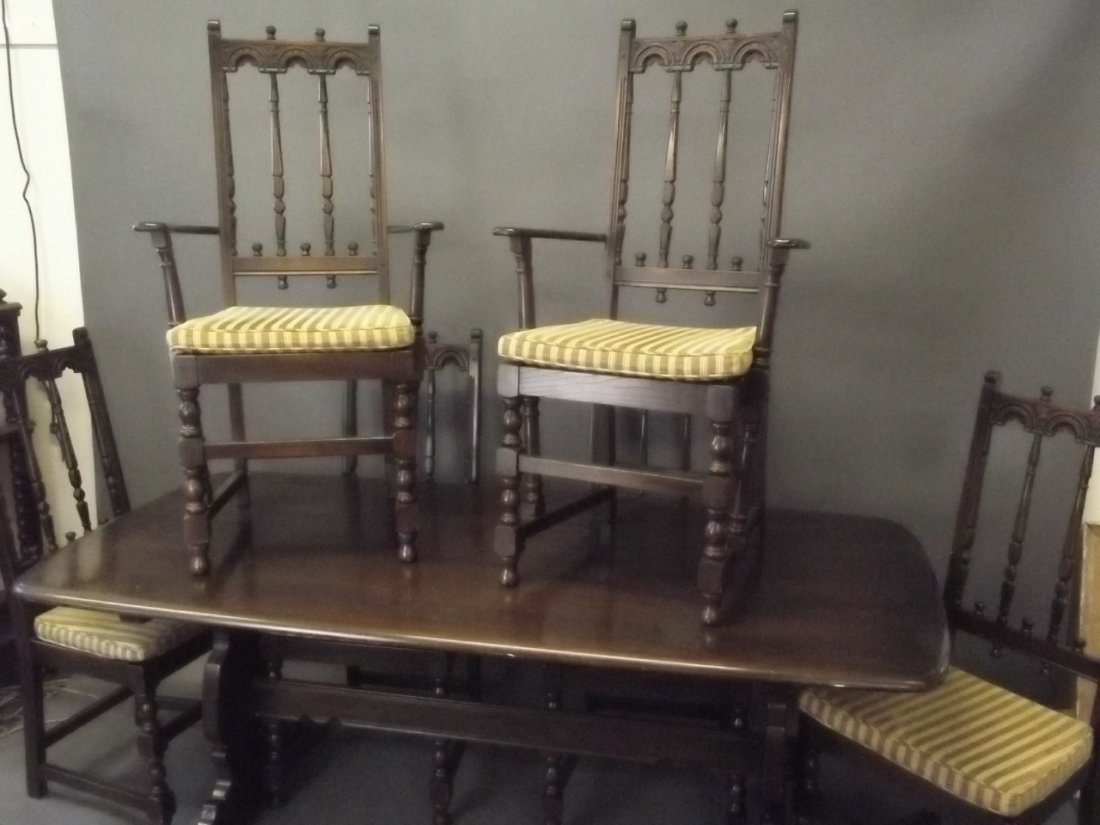 An Ercol dark oak dining table and six chairs, 72'' x: An Ercol dark oak dining table and six chairs, 72'' x 35'', 28'' high