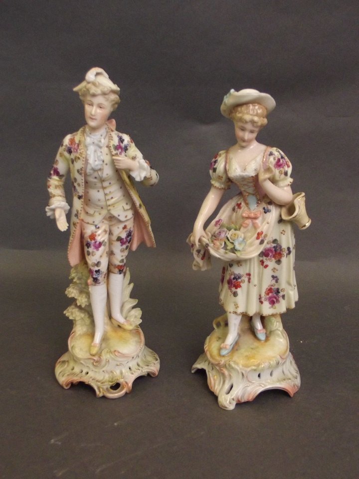 A pair of Continental porcelain figures of a man and (1 of 1)