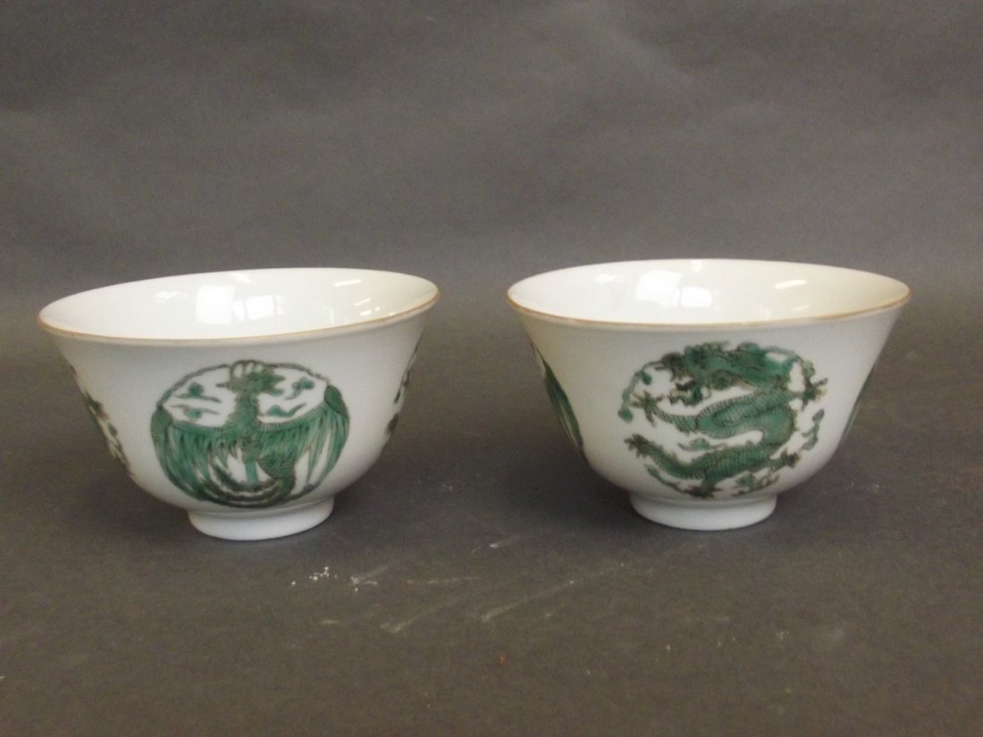 A pair of Chinese rice bowls decorated with dragons and (1 of 2)