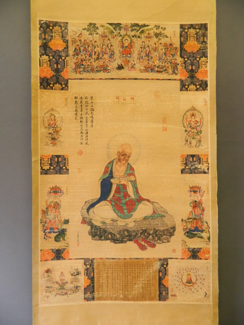 A Chinese watercolour scroll depicting Buddha seated,: A Chinese watercolour scroll depicting Buddha seated, surrounded by images of the Eight Immortals with acolytes, 24'' x 39½''