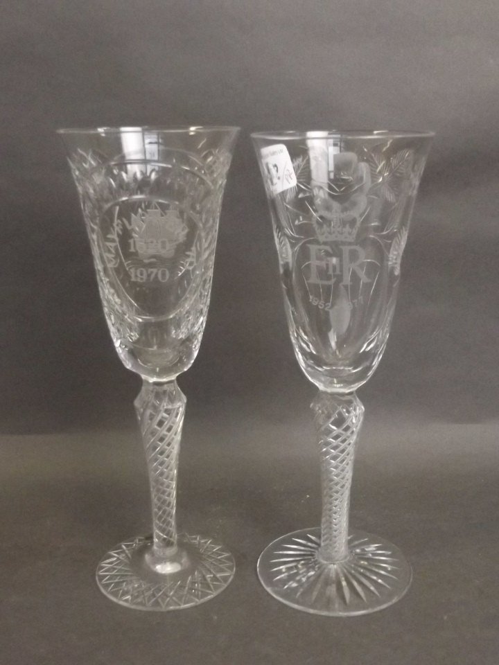 Two Webb Corbett cut and etched glass flutes: Two Webb Corbett cut and etched glass flutes commemorating the Silver Jubilee and Mayflower ship, engraved 'David Smith' to base, 8½'' high