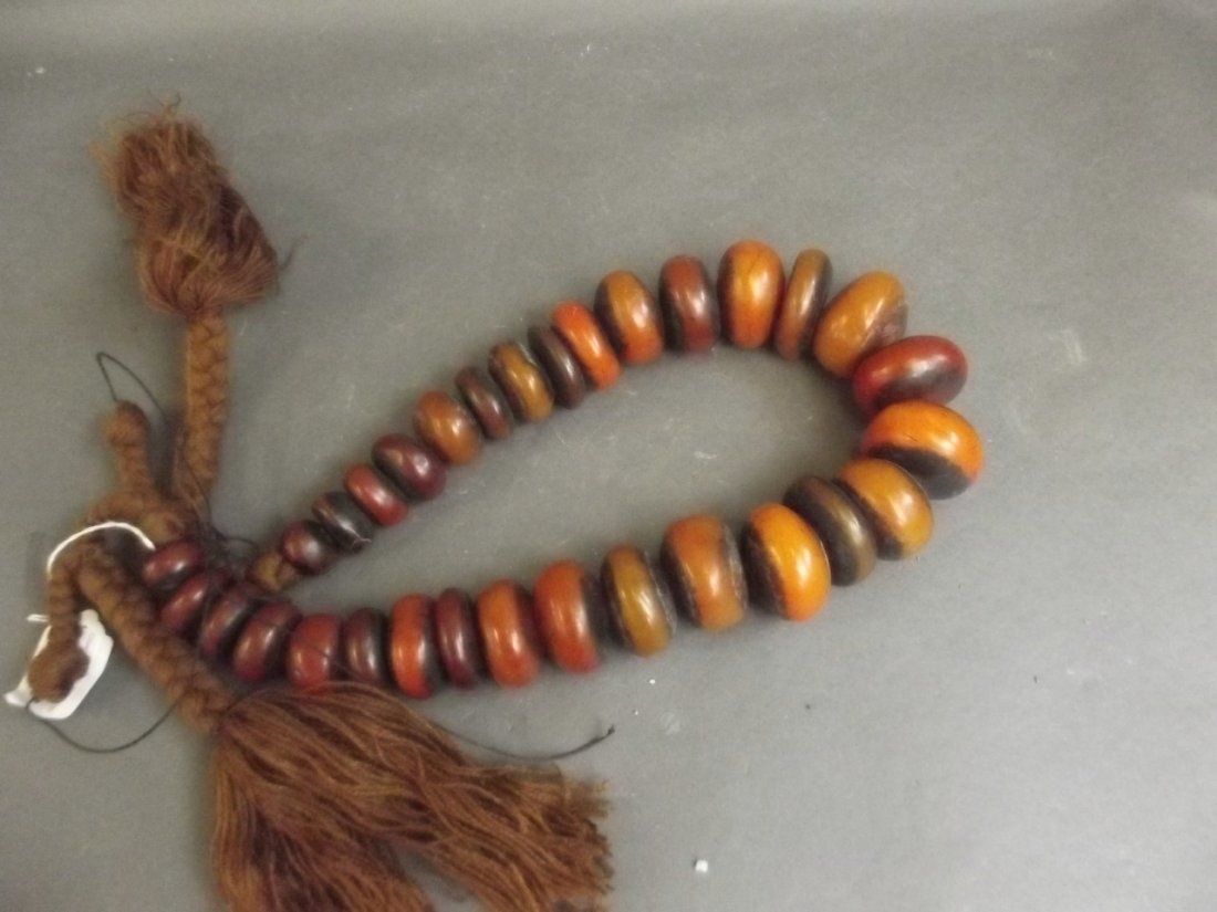 A large African composition beaded necklace, 40" long: A large African composition beaded necklace, 40" long