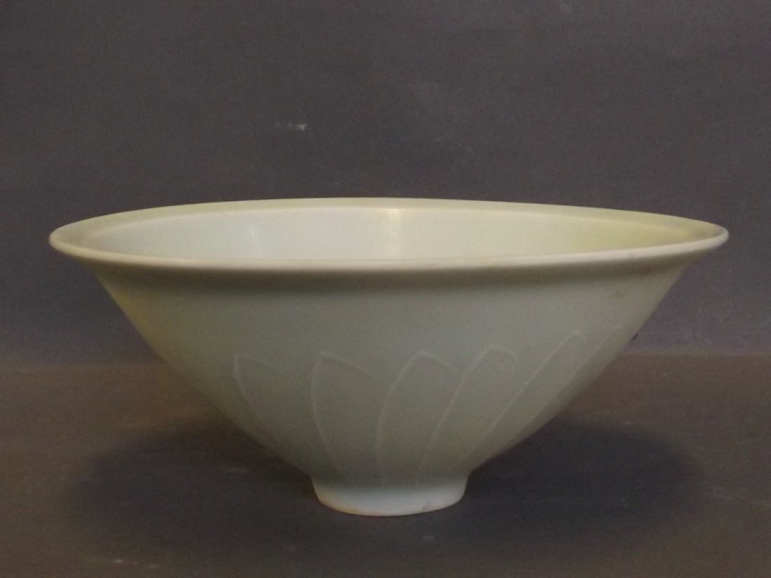 A Chinese celadon bowl with raised petal decoration,: A Chinese celadon bowl with raised petal decoration, 6'' diameter