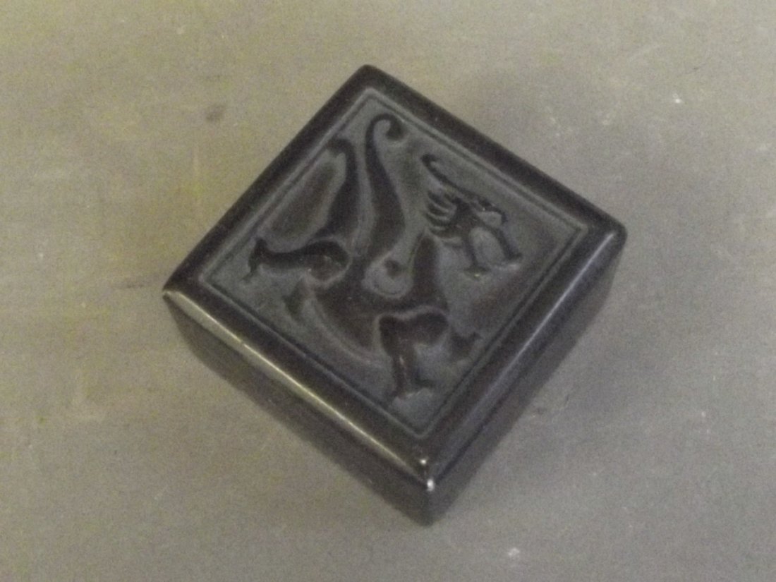A Chinese green hardstone box carved with a dragon, (1 of 3)