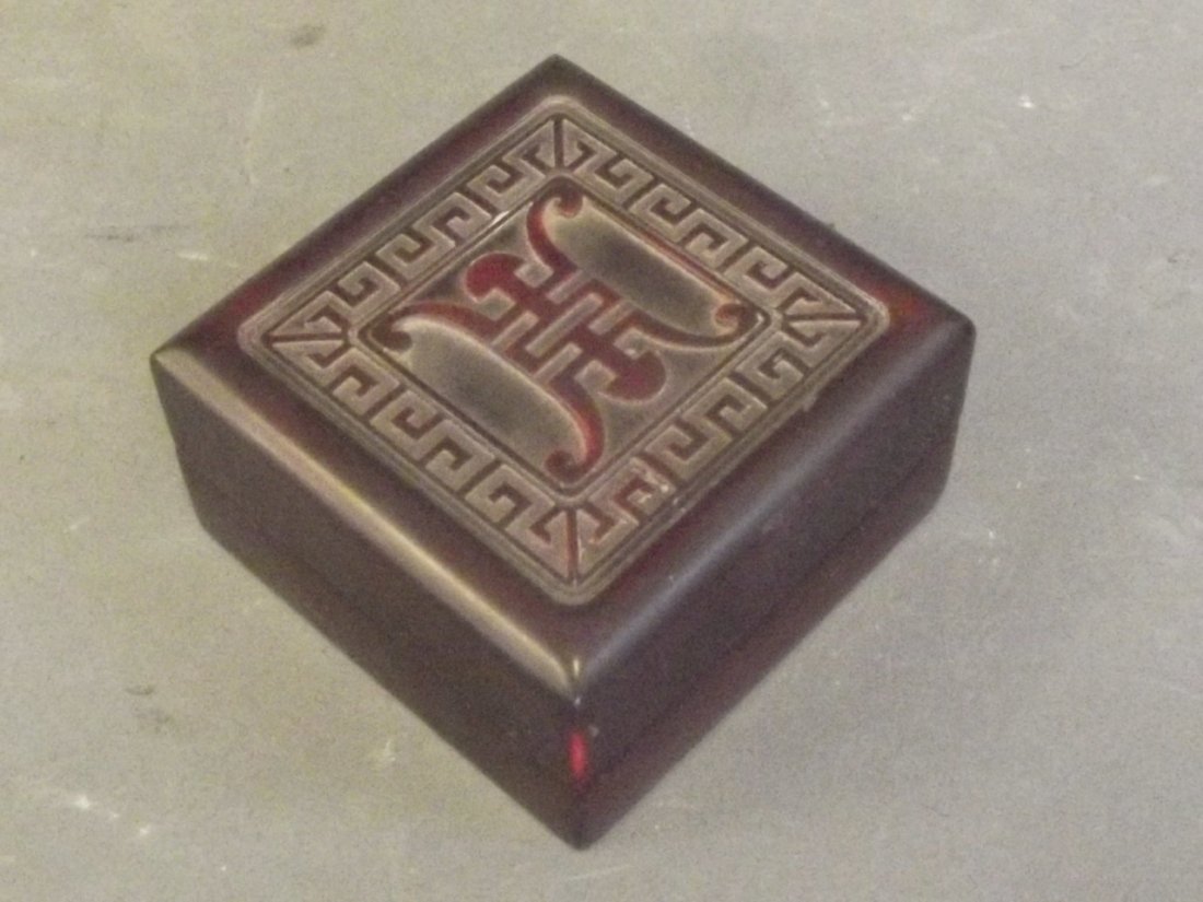 A Chinese red hardstone box with carved decoration of (1 of 3)