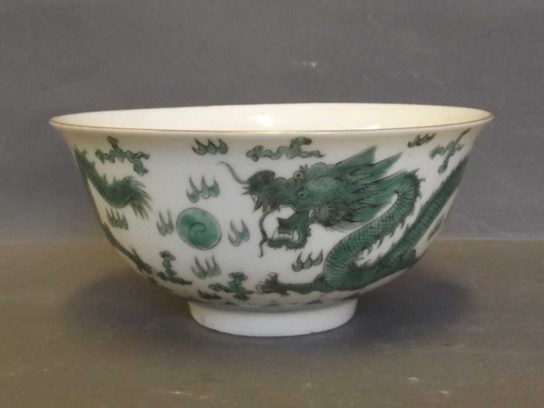 A Chinese bowl decorated with two green dragons chasing: A Chinese bowl decorated with two green dragons chasing the flaming pearl, printed mark to base, 6'' diameter