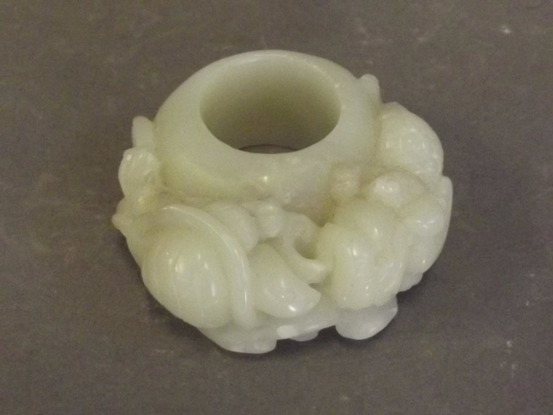 A large jade archers ring carved with a tortoise, (1 of 2)