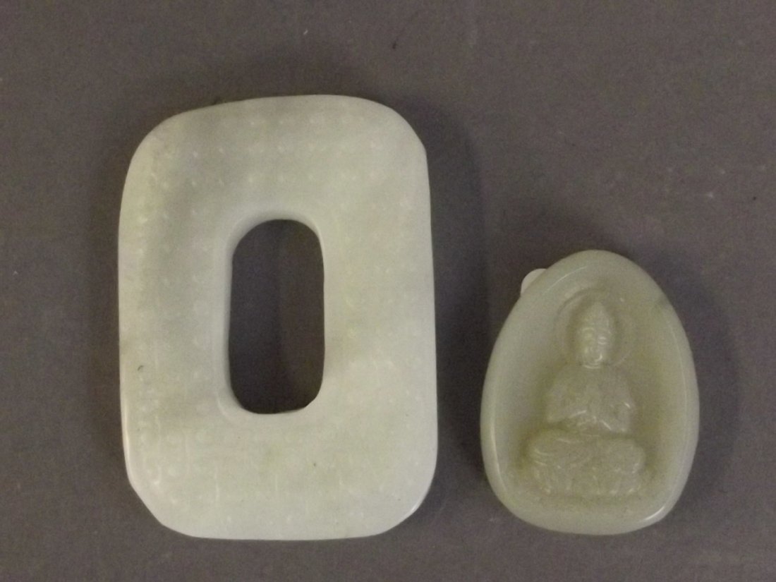 A carved jade ornament in the form of Quan Yin, and: A carved jade ornament in the form of Quan Yin, and another, 2'' long