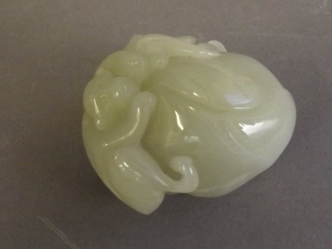 A small Chinese carved jade ornament carved in the form (1 of 1)