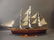A wood model of a C19th three-masted sailing ship with