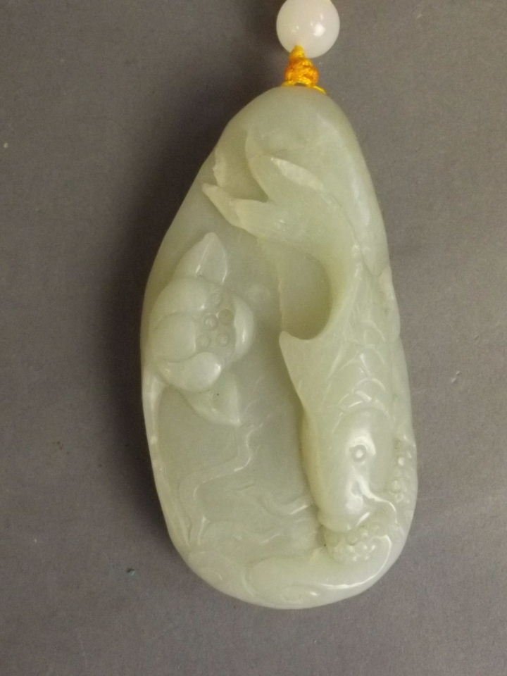 A Chinese celadon jade pendant with finely carved carp (1 of 1)