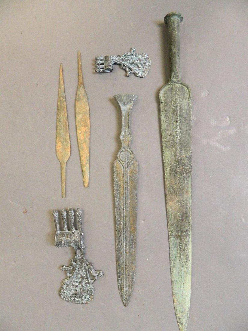 A quantity of Middle Eastern bronze swords, axe heads, (1 of 3)